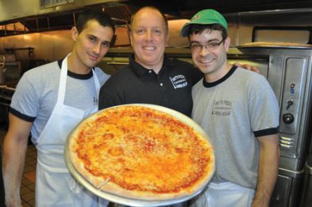 Pat’s Pizza : Co-owner Pat Newell with employees Kleber Pintz, left and Vinnie Felix. Photo by Bill Forry